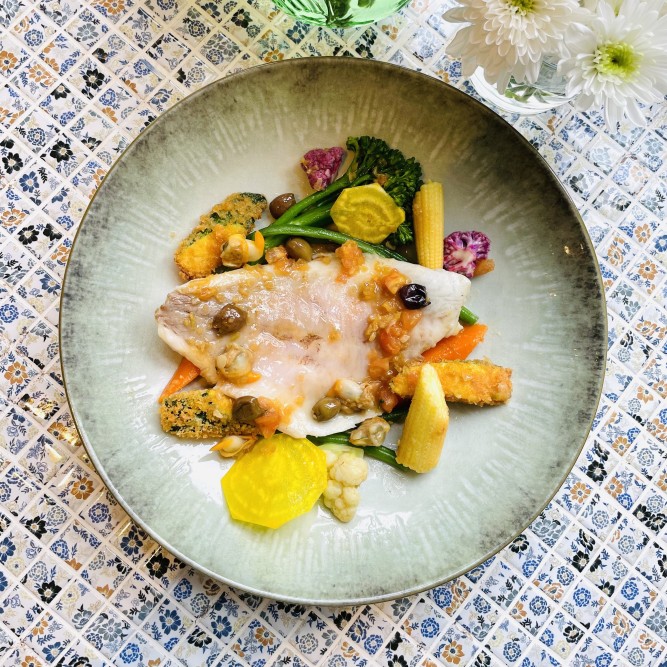Sea bream with bouillabaisse sauce and breaded zucchini